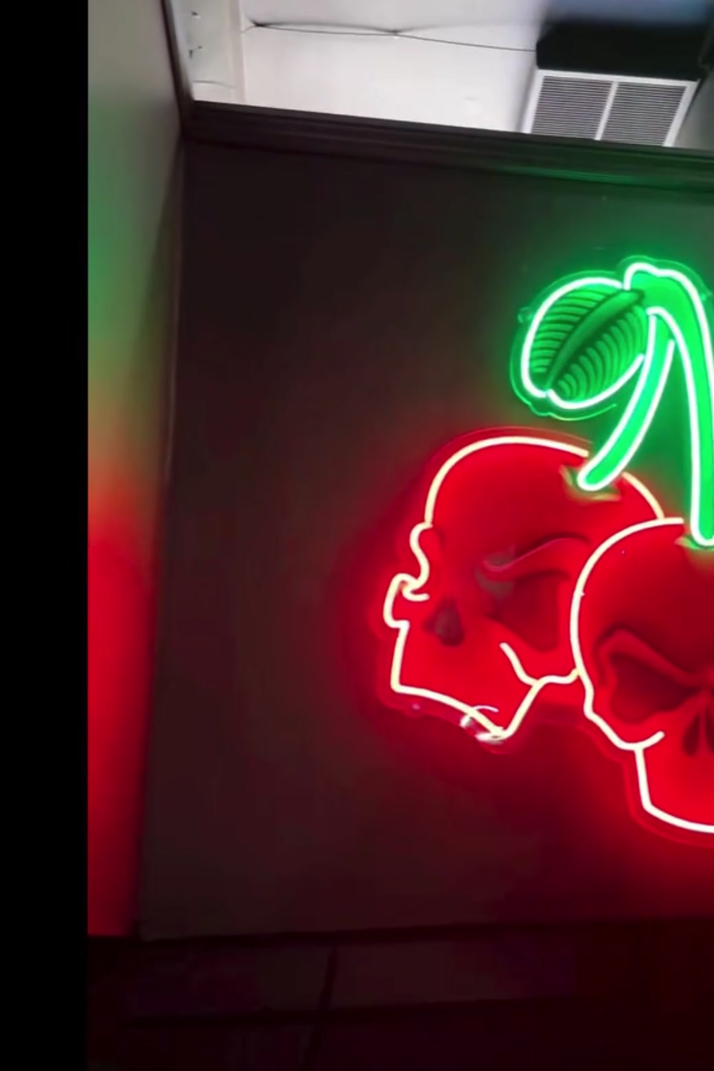 The Cherry's red neon cherry-skull sign