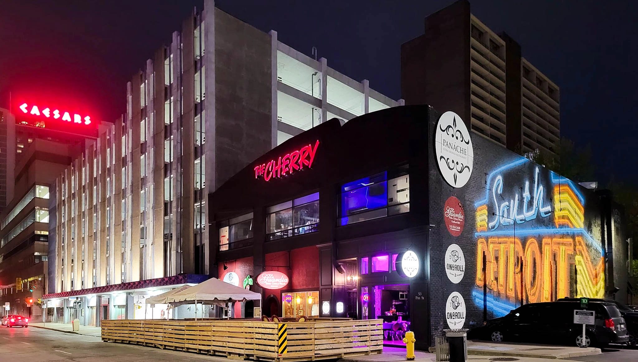 Pitt Street at night with The Cherry's sign lit up